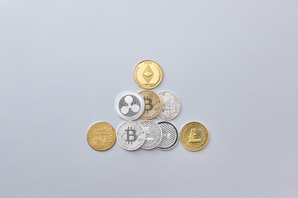 Assorted cryptocurrency coins arranged in a pyramid